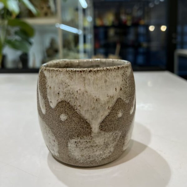 Cup with gray rabbits.